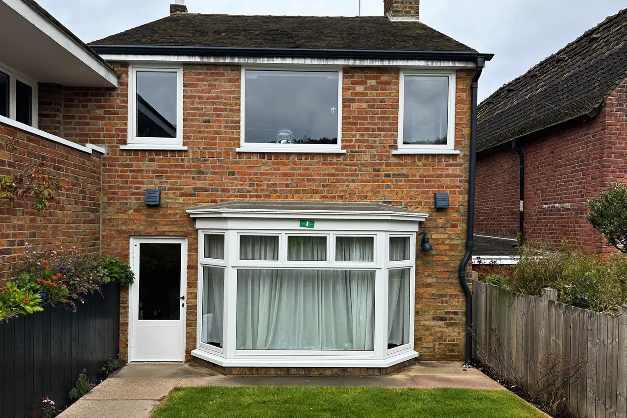 A brick bay window on the front of a UK home
